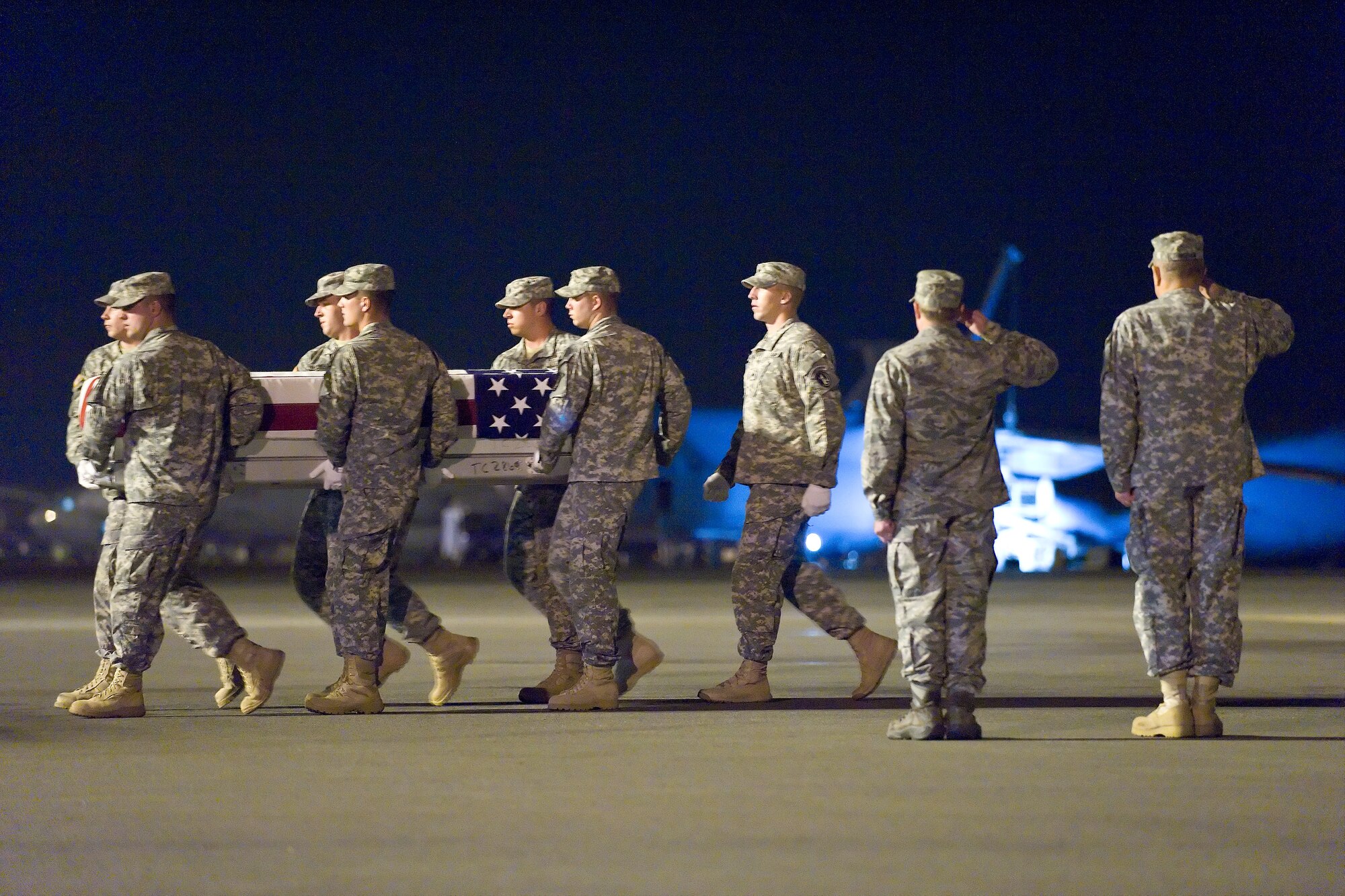 A U.S. Army carry team transfers the remains of Army Spc. Nicholas P. Bernier, of East Kingston, N.H., at Dover Air Force Base, Del., July 3, 2011. Nielson was assigned to the 2nd Battalion, 30th Infantry Regiment, 4th Brigade Combat Team, 10th Mountain Division, Fort Polk, La. (U.S. Air Force photo/Roland Balik)

