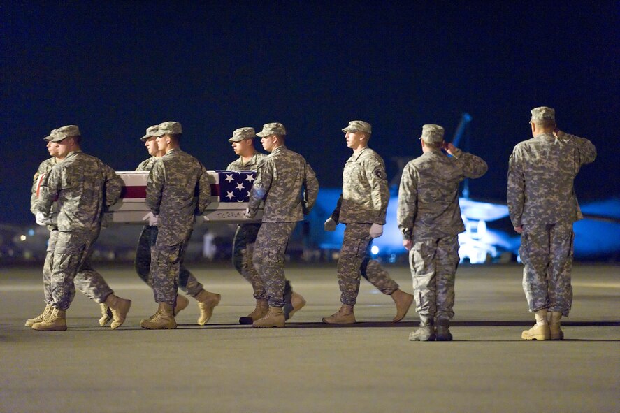 A U.S. Army carry team transfers the remains of Army Spc. Nicholas P. Bernier, of East Kingston, N.H., at Dover Air Force Base, Del., July 3, 2011. Nielson was assigned to the 2nd Battalion, 30th Infantry Regiment, 4th Brigade Combat Team, 10th Mountain Division, Fort Polk, La. (U.S. Air Force photo/Roland Balik)
