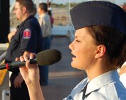 LAUGHLIN AIR FORCE BASE, Texas -- Senior Airman Alli Haynes, 47th Flying Training Wing staff, sings the National Anthem at the Rotary Rodeo held at the Val Verde County Fairgrounds in Del Rio July 1. Rodeo organizers provided more than 600 tickets to Laughlin members and recognized them at the event. (U.S. Air Force photo by Joel Langton)