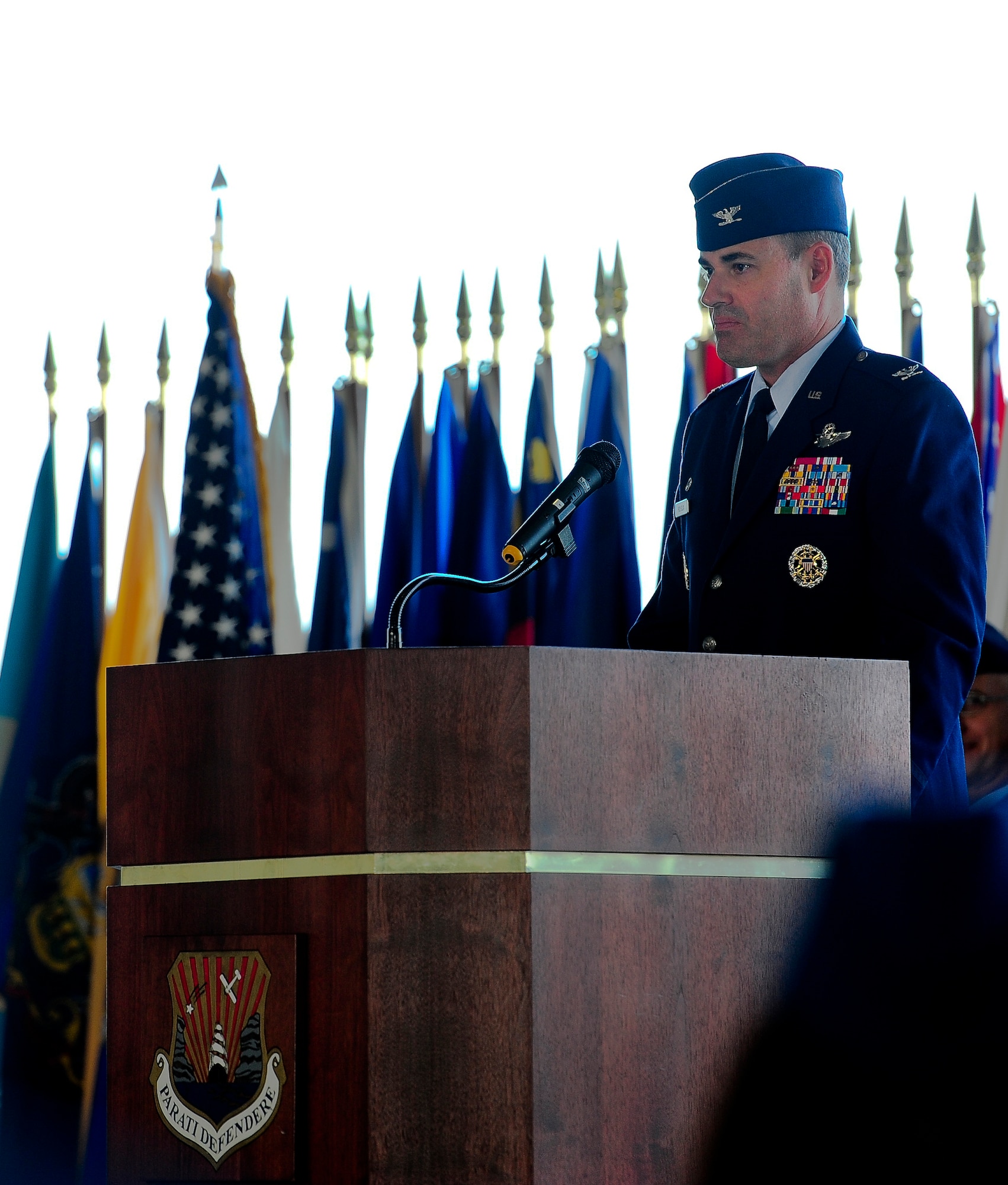 Col. Lenny Richoux, 6th Air Mobility Wing commander, addresses the crowd during the 6th Medical Group Change of Command Ceremony, July 5, 2011 in Hangar 3 at MacDill Air Force Base, Fla. At the ceremony Col. Dennis Beatty relinquished command to Col. Robert Rocco. (U.S. Air Force photo by Airman Basic David Tracy)