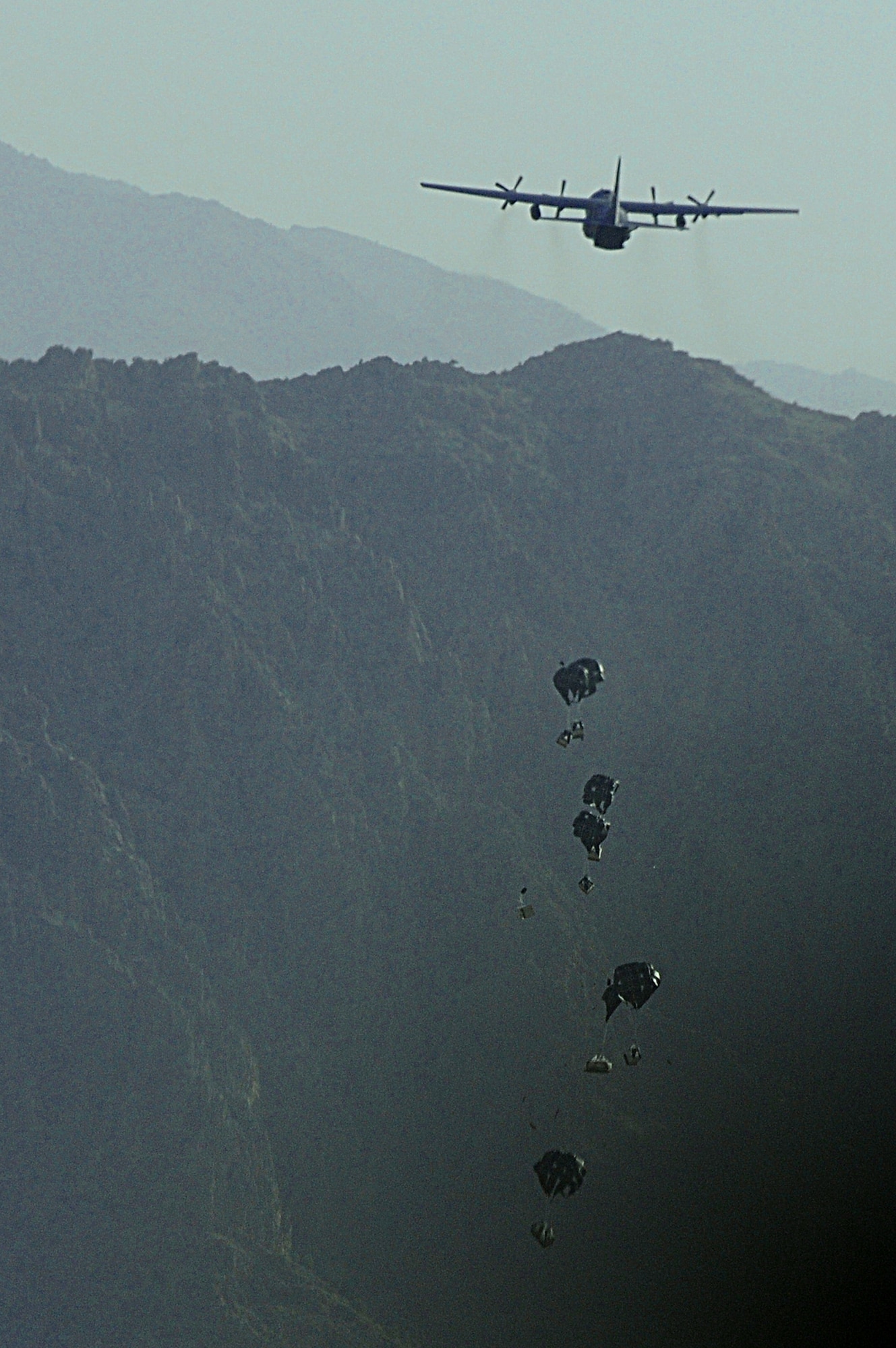 A C-130 Hercules aircrew from the New York Air National Guard's 107th Airlift Wing airdrops supplies June 22, 2011, to a forward operating base in Oruzgan Province, Afghanistan. (U.S. Air Force photo/Senior Airman Krista Rose)