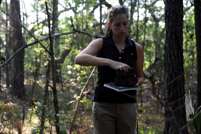 Kristina Lanphea, a researcher from the College of Charleston, carries bricks that she will use for research at Joint Base Charleston- Weapons Station June 21. Lanphea is preparing her thesis on the history of brick making. (U.S. Air Force photo/ Staff Sgt. Nicole Mickle)  