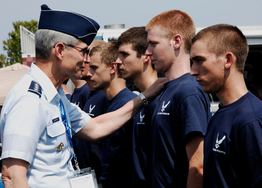 Air Force Chief of Staff Gen. Norton Schwartz gives words of advice to a member of the Delayed Entry Program July 2, 2011, at the Coke Zero 400 in Daytona Beach, Fla. Before administering the oath of enlistment to the DEP members, Schwartz thanked all the parents for helping their sons and daughters on the first step of their Air Force careers. (U.S. Air Force photo by Airman 1st Class Brigitte N. Brantley/Released)
