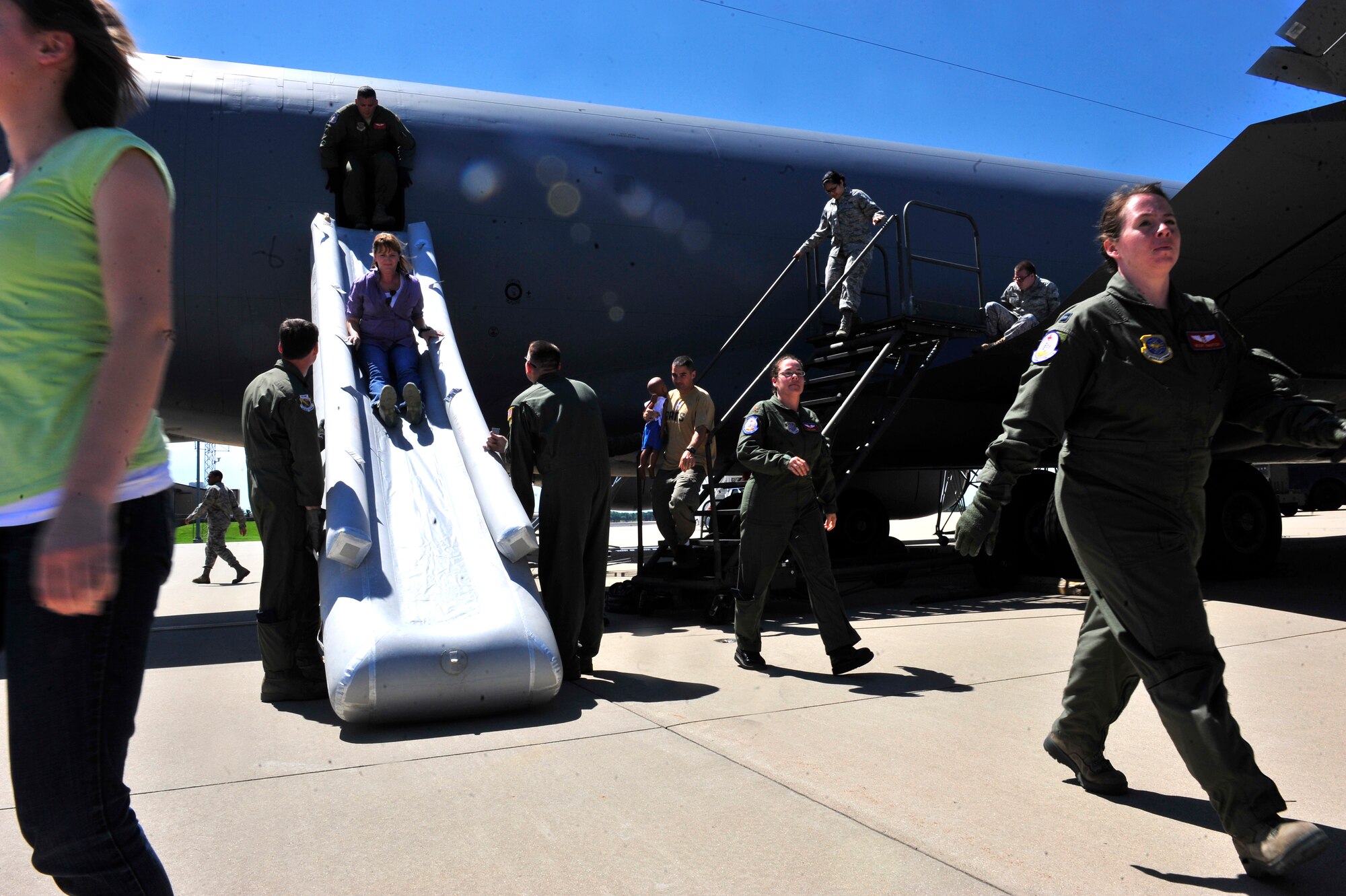 Tech. Sgt Matthew Worcester and Master Sgt. Kevin Valasek fill out an inspection sheet after a KC-135 egress scenario on Scott AFB June 28, 2011. Sergeant Worcester is an evaluator from the Test and Evaluations Squadron at Dover AFB, Del., and Sergeant Valasek is an evaluator from the AMC TES at Scott AFB. The AMC directed test was used to determine the quantity of passengers one passenger monitor can safely egress, or evacuate, from an aircraft in 90 seconds. (U.S. Air Force photo/ Staff Sgt. Stephenie Wade)