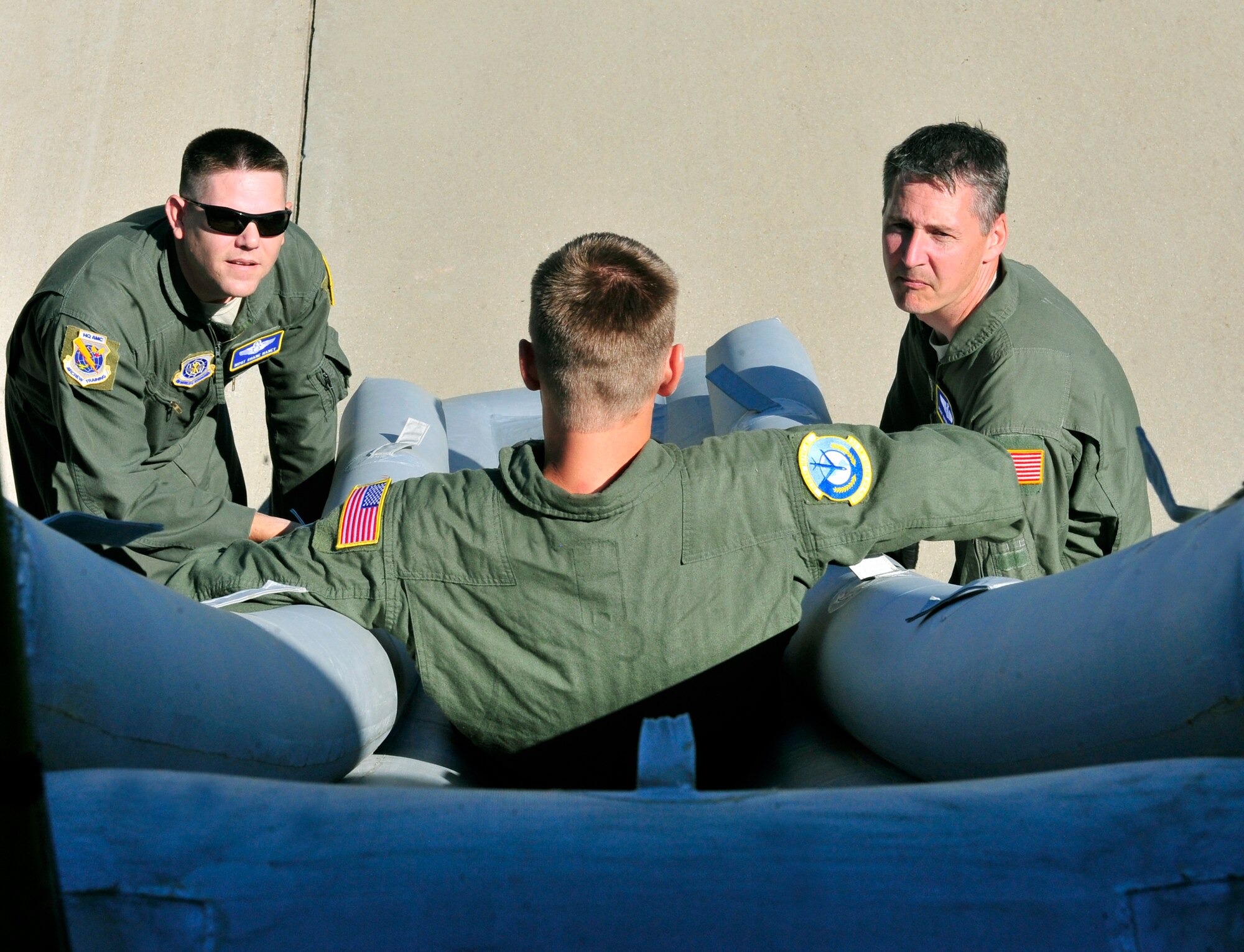 Airman 1st Class Jarrett Crawford evacuates down an aft slide on a KC-135 during an egress scenario on Scott AFB June 28, 2011. Airman Crawford is a boom operator apprentice at the 906th Air Refueling Squadron. The AMC directed test was used to determine the quantity of passengers one passenger monitor can safely egress, or evacuate, from an aircraft in 90 seconds. (U.S. Air Force photo/ Staff Sgt. Stephenie Wade)