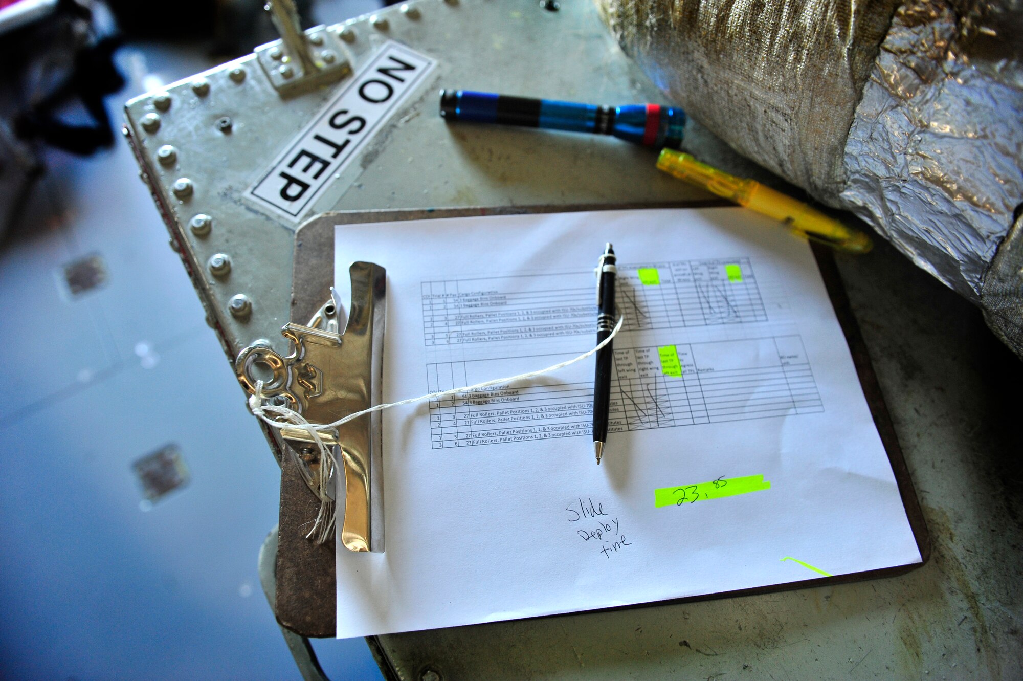 A test evaluation sheet waits to be used during a KC-135 for ground egress scenario on Scott AFB, June 28, 2011. The AMC directed test was used to determine the quantity of passengers one passenger monitor can safely egress, or evacuate, from an aircraft in 90 seconds. (U.S. Air Force photo/ Staff Sgt. Stephenie Wade)
