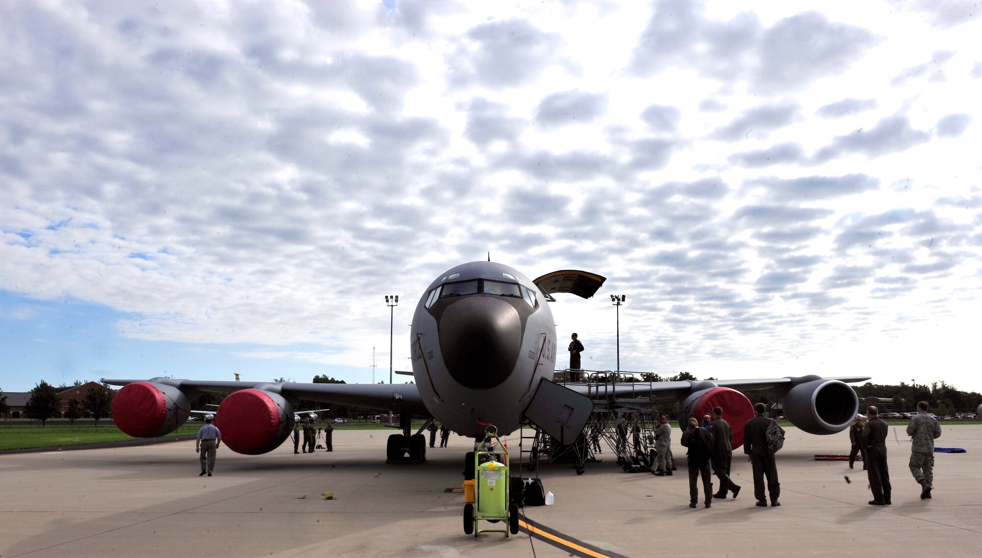 Flight crew members and test evaluators set up a KC-135 for a ground egress scenario on Scott AFB June 28, 2011. The AMC directed test was used to determine the quantity of passengers one passenger monitor can safely egress, or evacuate, from an aircraft in 90 seconds. (U.S. Air Force photo/ Staff Sgt. Stephenie Wade)