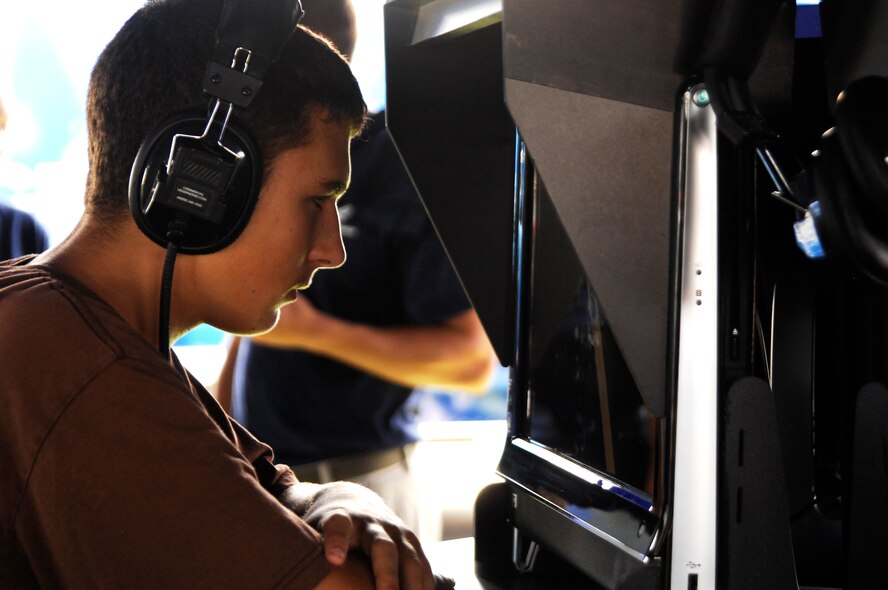 Patrick Hood, 14, of Smyrna Beach, Fla., checks out a computer July 2, 2011, at an Air Force recruiting display at the Coke Zero 400 in Daytona Beach, Fla. As a technology enthusiast, he was one of many youth who stopped by the display to learn more about the Air Force and what it has to offer. (U.S. Air Force photo by Airman 1st Class Brigitte N. Brantley /Released)