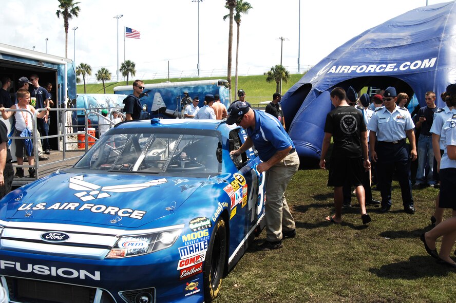 The Air Force-sponsored #43 car is displayed at a recruiting display July 2, 2011, prior to the start of the Coke Zero 400 at Daytona Beach, Fla. The Air Force recruits at NASCAR events because of the mechanically-inclined youth who are often fans of racing. The car’s driver, A.J. Allmendinger, placed 10th in the race. (U.S. Air Force photo by Airman 1st Class Brigitte N. Brantley /Released)