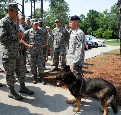 Gen. Raymond E. Johns Jr. talks with Staff Sgt. Clifford Hartley during a visit to the dormitories at Joint Base Charleston- Air Base June 29. Johns toured JB CHS- AB and Weapons Station during his two day visit. Johns is the Air Mobility Command commander and Hartley is a dog handler with the 628th Security forces Squadron. (U.S. Air Force photo/ Staff Sgt. Nicole Mickle)