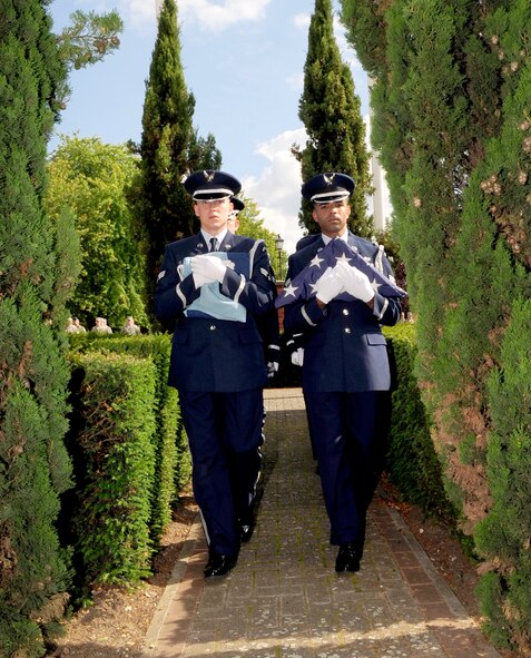 RAF MILDENHALL, England – Senior Airman Dalyn Lipps and Staff Sgt. Emmanuel Santillan, Team Mildenhall Honor Guard members, perform flag security detail during retreat here July 1, 2011. The retreat ceremony pays honor to the flag, as well as signifying the end of the duty day. (U.S. Air Force photo/Senior Airman Ethan Morgan)