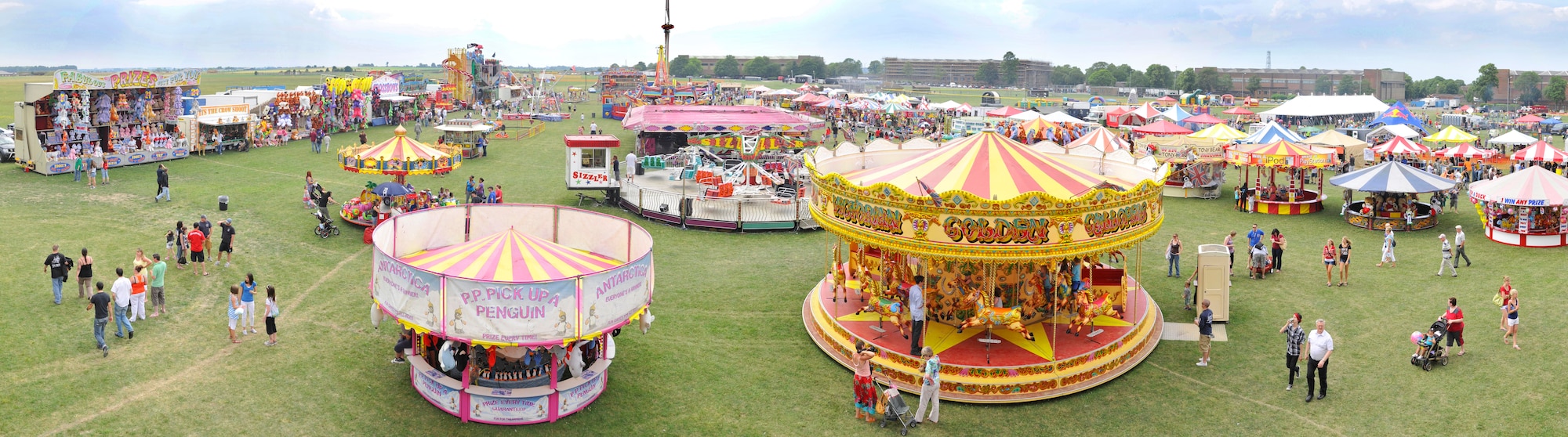 ROYAL AIR FORCE FELTWELL, England - Celebration participants enjoy a carnival during the Fourth of July celebration, July 4, 2011. Approximately 30,000 Airmen, their families and local community members came together to celebrate America’s Independence Day. Attendees enjoyed a variety of food, played games, watched aerial displays, rode carnival rides and watched fireworks. (U.S. Air Force photo illustration/Senior Airman Tiffany M. Deuel)