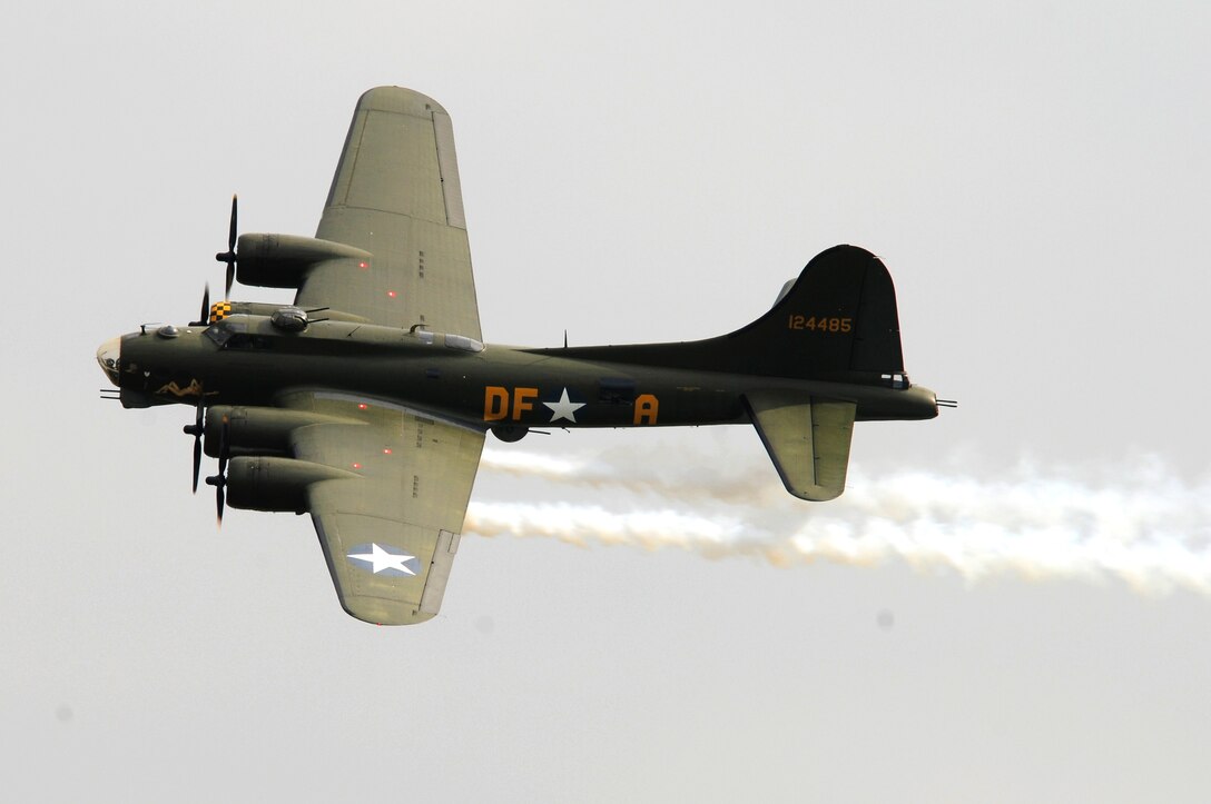 ROYAL AIR FORCE FELTWELL, England -- The B-17 Flying Fortress "Sally B" performs a flyover during the Fourth of July celebration, July 4, 2011.  Airmen, their families and local community members came together to enjoy a carnival filled with food, games, rides, aerial displays and fireworks. (U.S. Air Force photo/Staff Sgt. Connor Estes)