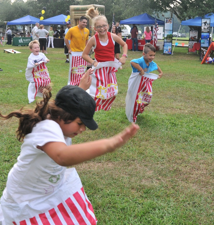 Participants of a sac race hop their way to the finish line during Freedom Fest 2011 at Joint Base Charleston – Weapons Station July 1. More than 300 service members and their families attended the festival which included games, prizes, food and fireworks. (U.S. Air Force photo/Jared Trimarchi)
