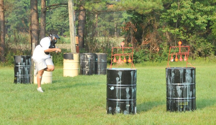 Geneva Garrett tries to dodge paintballs during Freedom Fest 2011 at Joint Base Charleston – Weapons Station July 1. Garrett is a recreation aide from the Liberty program.
