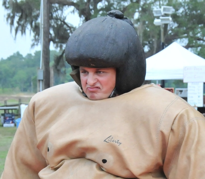 Ensign Michael Overton stares down his opponent before a sumo battle during Freedom Fest 2011 at Joint Base Charleston – Weapons Station July 1. Overton is assigned to the Navy Nuclear Power Training Command. (U.S. Air Force photo/Airman Jared Trimarchi)