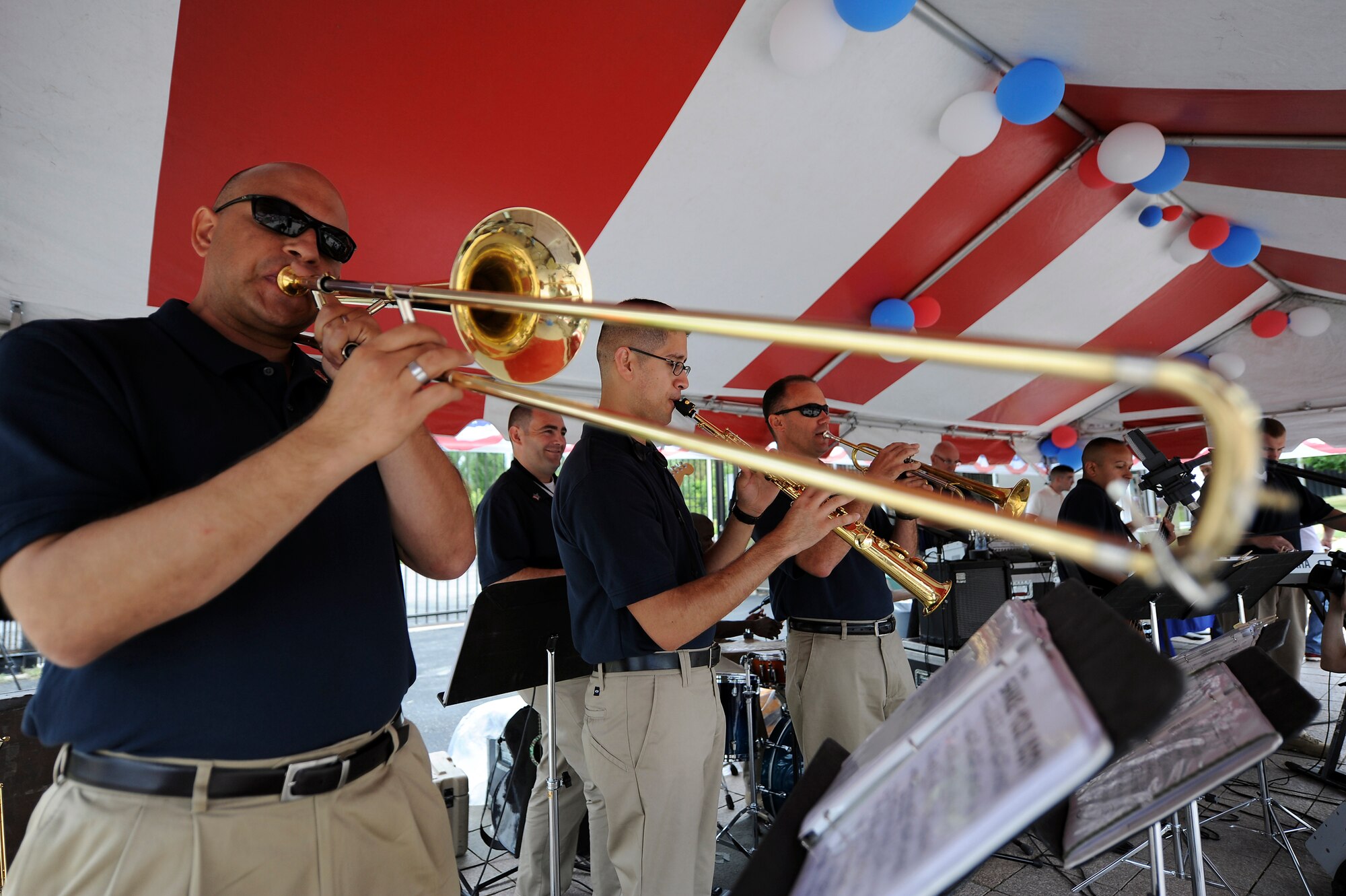 BISHKEK, Kyrgyzstan – Airmen in the band “Blue Hawk” perform at the American Embassy’s community Fourth of July celebration here July 2. The band is composed of U.S. Air Force Guardsmen assigned to Naval Air Station Fort Worth Joint Reserve Base, Texas. The band members spent the weekend leading up to Independence Day, and the holiday, performing for Americans and Kyrgyz citizens at the U.S. Embassy, the Transit Center, in the nation’s capital Bishkek and a cancer center. (U.S. Air Force photo/Staff Sgt. Matthew Smith)