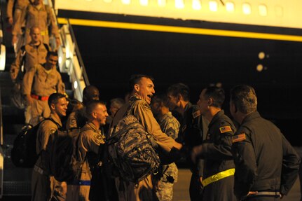 Airmen from the 17th Airlift Squadron arrive  on Joint Base Charleston Air Base, S.C, July 1. More than 120 Airmen from the 17th AS returned home after a four-month deployment to the Middle East.  While deployed, the Airmen flew roughly 2,850 sorties and airlifted more than 107 million pounds of cargo throughout the area of responsibility.  (U.S. Air Force photo Staff Sgt. Nicole Mickle)