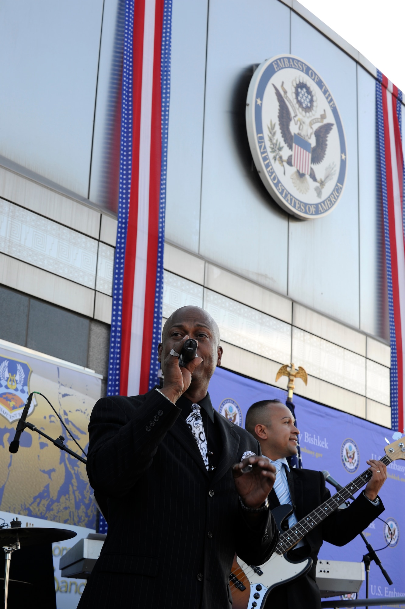 BISHKEK, Kyrgyzstan – Tech. Sgts. Lane McCray and Marcelo Perez perform at the American Embassy’s official Fourth of July celebration here July 1. Air Forces Central Band “Blue Hawk” spent the weekend leading up to Independence Day, and the holiday, performing for Americans and Kyrgyz citizens at the U.S. Embassy, the Transit Center, in the nation’s capital Bishkek and a cancer center. (U.S. Air Force photo/Staff Sgt. Matthew Smith)