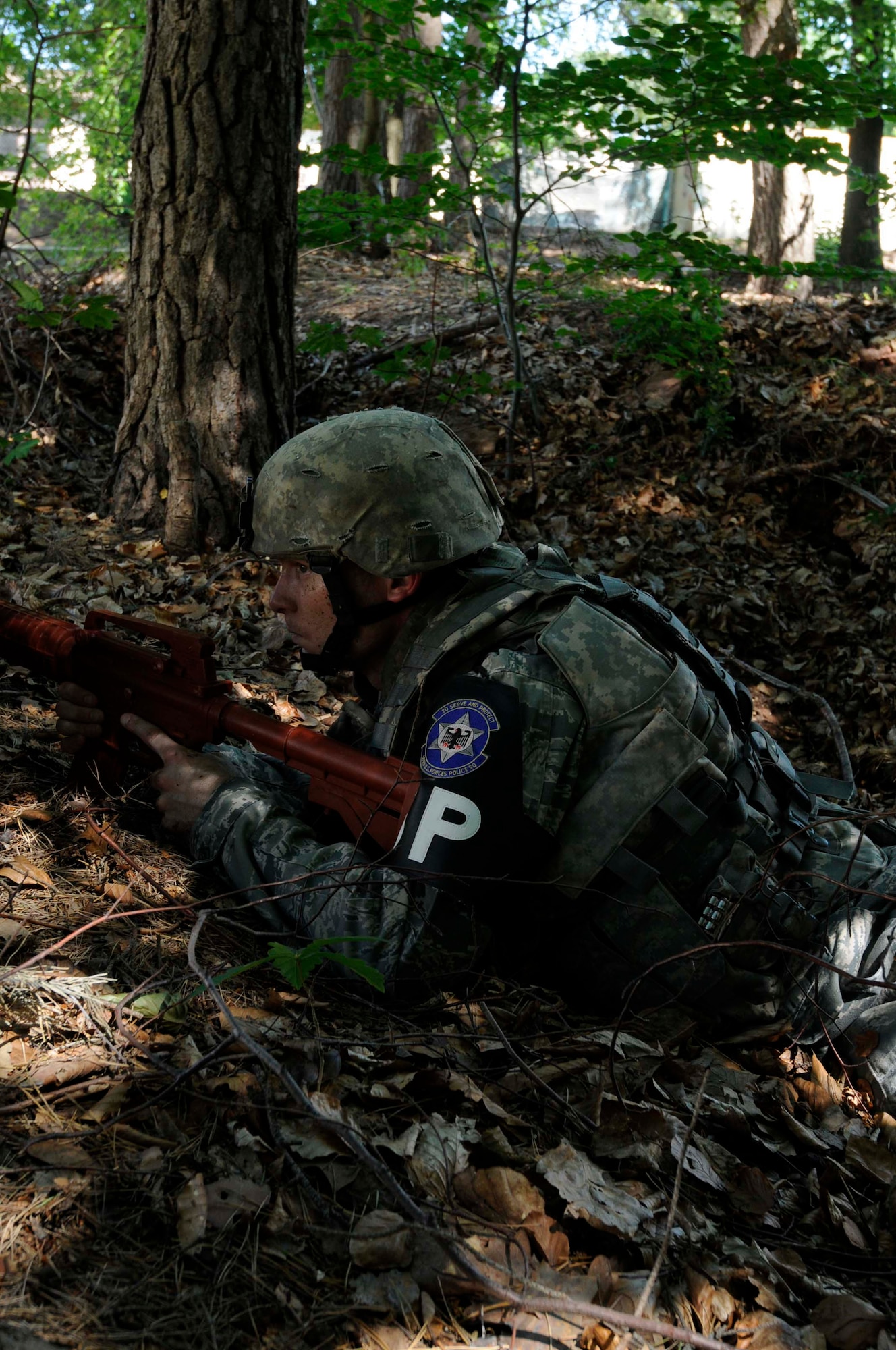 Air Force Staff Sgt. Jamie Barnett, 569th U.S. Forces Police Squadron, secures the area of from a suspect during an active-shooter exercise, Ramstein Air Base, Germany, June 27, 2011. The exercise was conducted to evaluate the units' response capabilities. (U.S. Air Force photo by Airman 1st Class Kendra Alba)
