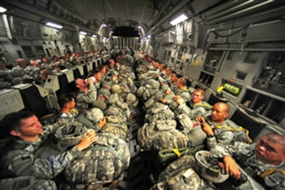 Army paratroopers wait to perform a personnel airdrop mission during a joint operational access exercise on Fort Bragg N.C., June 25, 2011. 