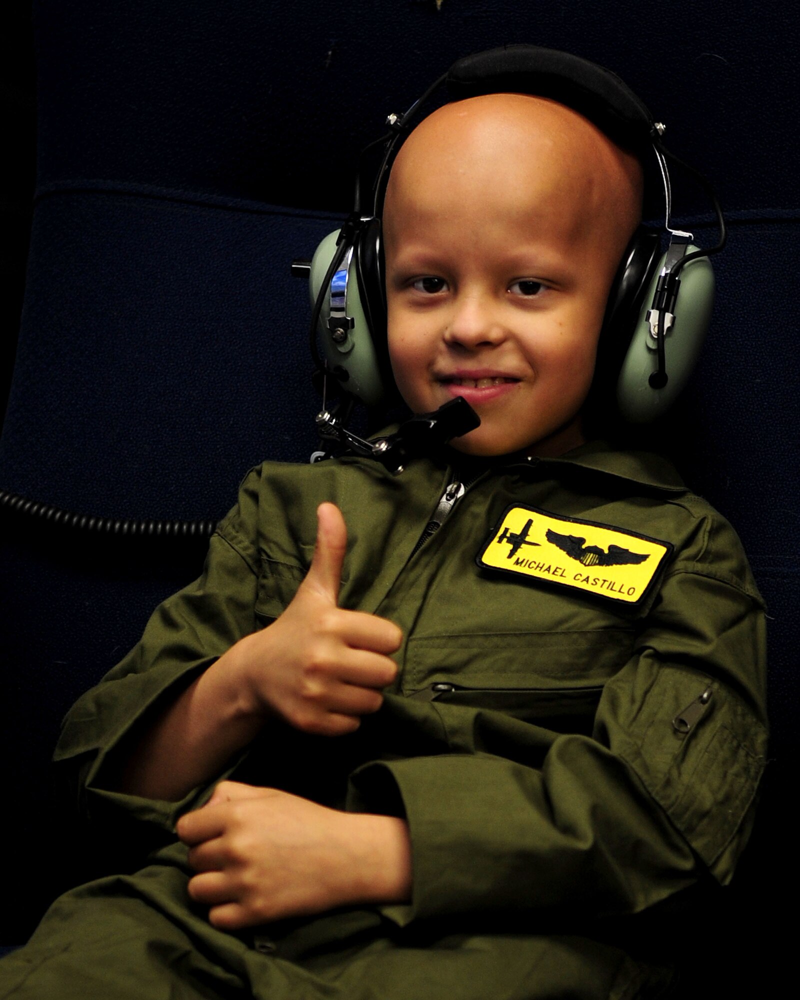 DAVIS-MONTHAN AIR FORCE BASE, Ariz. -Pilot for a Day participant, Michael Castillo, gives thumbs up after experiencing the A-10 simulator at the 355th Operations Group here June 24. As the Pilot for a Day, Michael and his family were given a tour of the base to include the 357th Fighter Squadron, the 355th Security Forces Squadron military working dog section and the D-M Fire Department. (U.S. Air Force photo/Airman 1st Class Jerilyn Quintanilla)