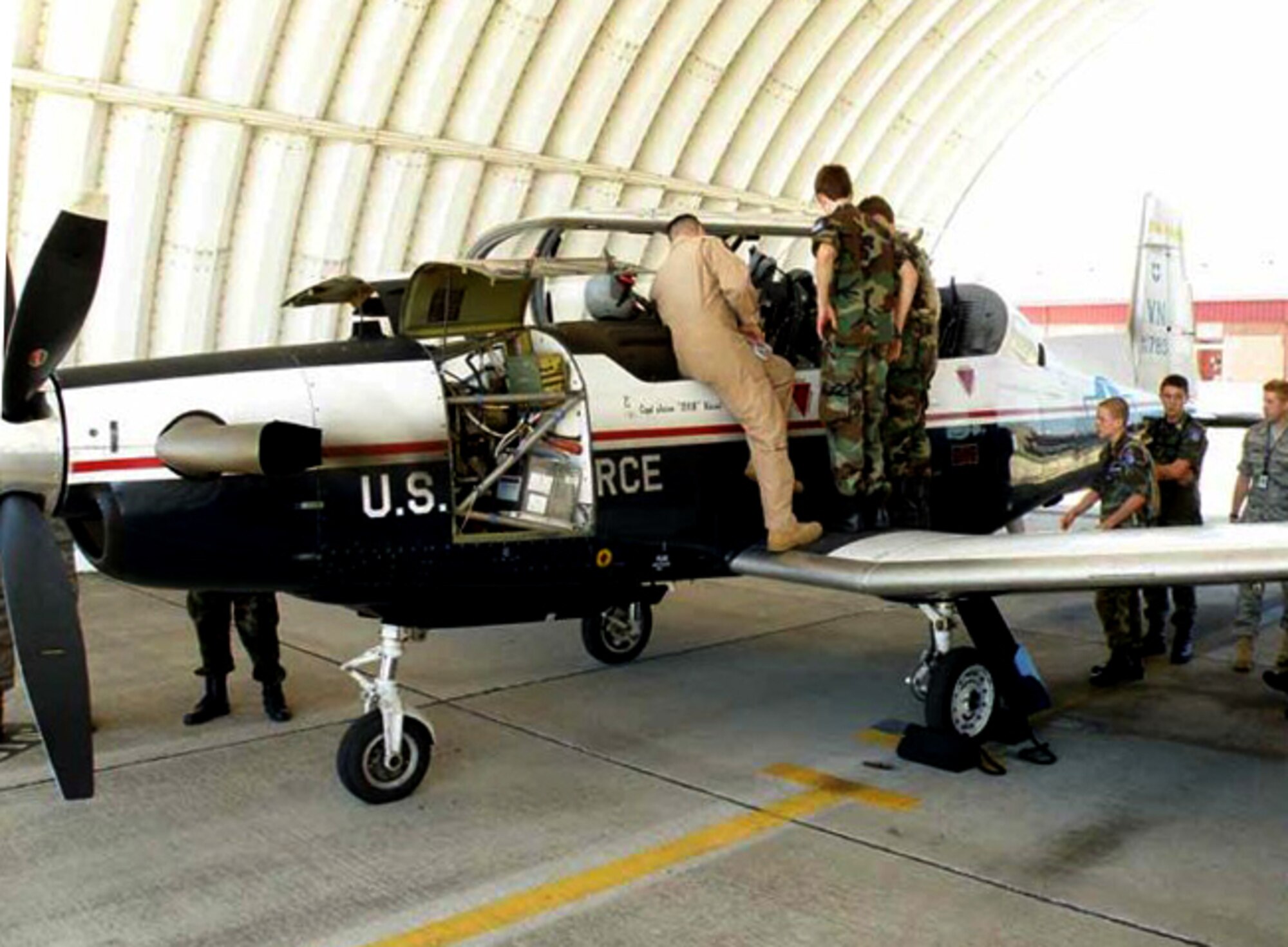 Civil Air Patrol cadets attending the 2011 Oklahoma Wing Summer Encampment at the Tulsa International Airport, in Tulsa, Okla., get a close up look at a T-6A trainer aircraft from Vance AFB, Okla. (Courtesy photo)