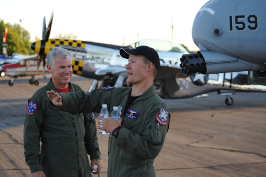 Left, Lee Lauderback and the A-10 West Demonstration team pilot Capt. Joe "Rifle" Shetterly recall their performance of the Heritage Flight in the Celebration of Flight air show at the Caldwell Industrial Airport in Caldwell, Idaho on June 25. (U.S. Air Force photo by Tech. Sgt. Becky Vanshur)