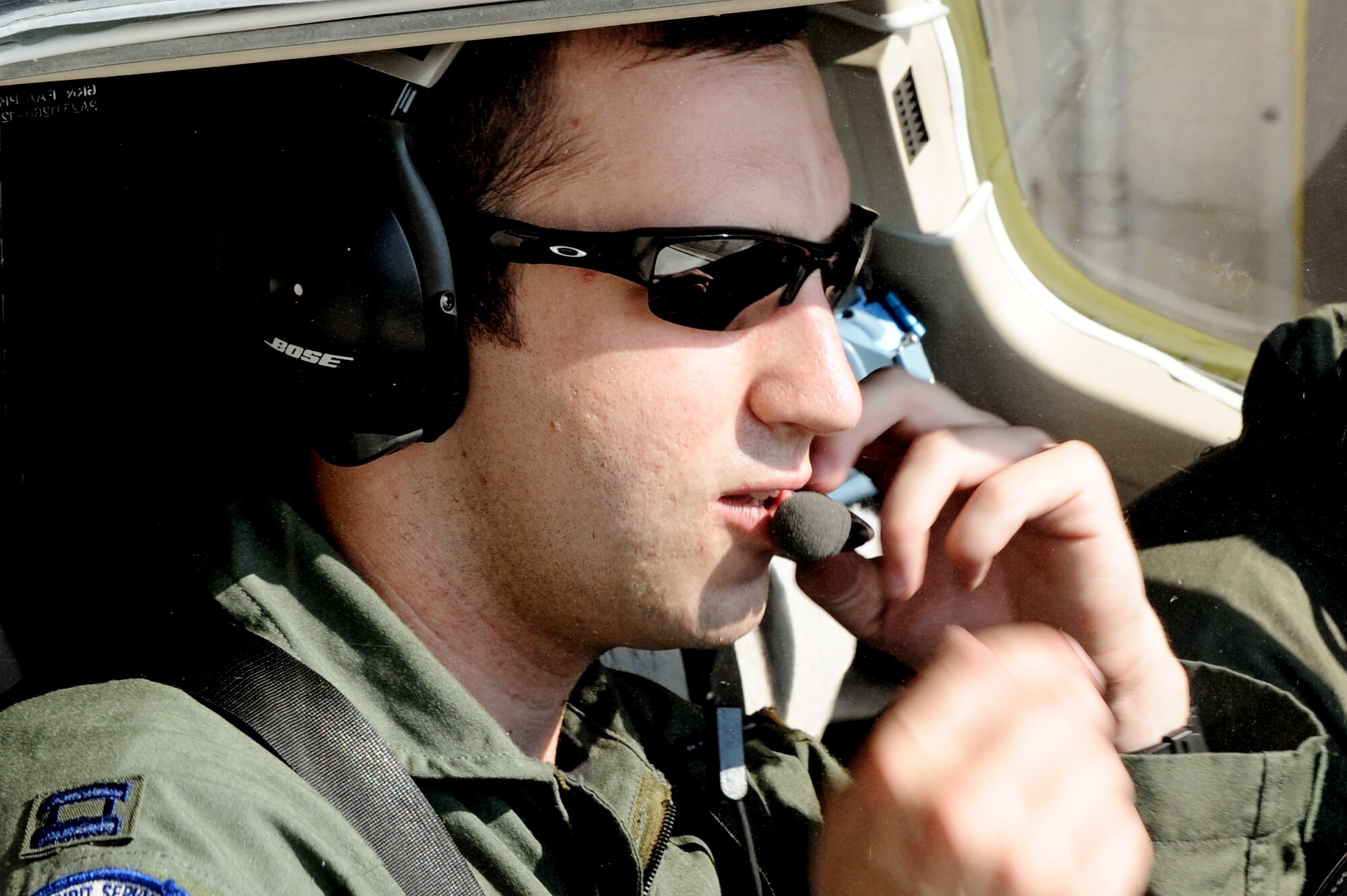Capt. Shaun Hibshman, 76th Airlift Squadron, performs pre-flight checks prior to take-off during the first flight of the instructor pilot course at the C-21A formal training unit at Scott Air Force Base, Ill. July 6, 2011. Captain Hibshman was the first to fly in the instructor pilot course under the 458th AS since it regained the C-21 training mission from the 45th AS at Kessler AFB, Miss. Captain Hibshman will return to the 76th AS at Ramstein Air Base upon graduation. (U.S. Air Force Photo/Staff Sgt. Brian J. Valencia)