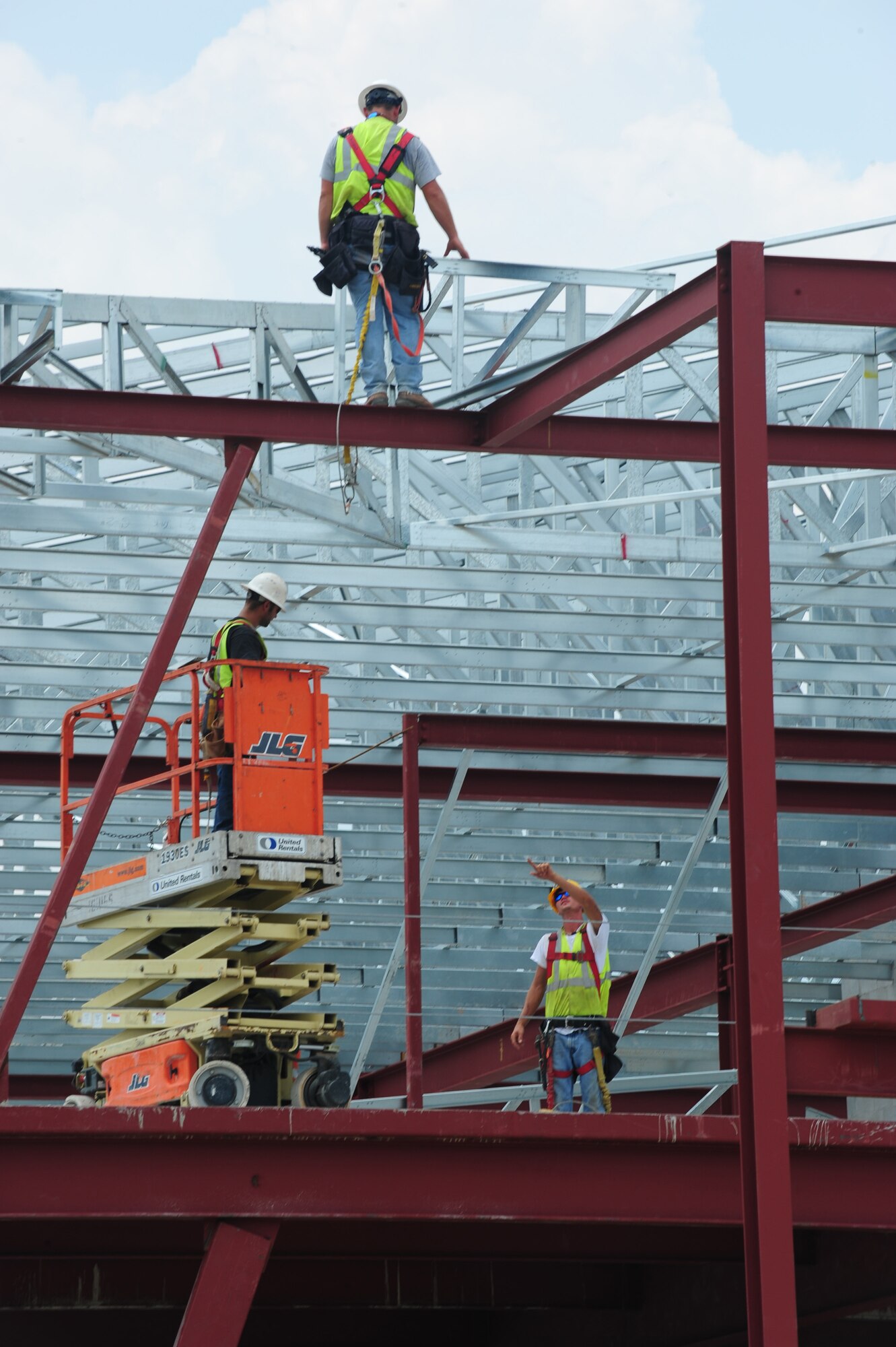 Contractors lay support sheet on the roof of the future 93rd Air Ground Operations Wing and 23rd Mission Support Group headquarters building at Moody Air Force Base, Ga., July 6, 2011. The framing work for the building has been laid, and it is scheduled to be completed in early 2012. (U.S. Air Force photo by Senior Airman Stephanie Mancha/Released)