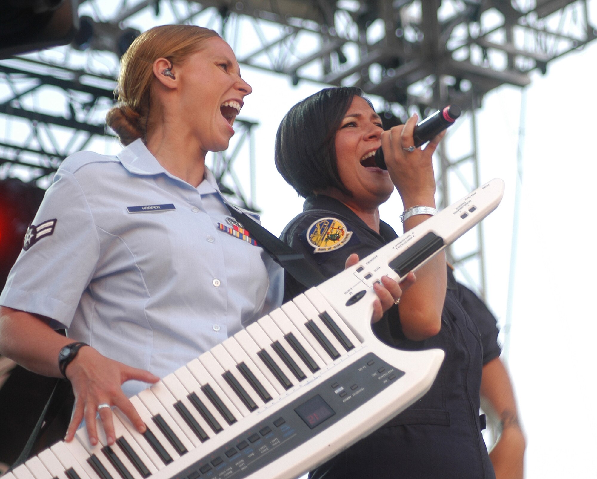 A1C Michelle Hooper and SSgt. Frances Kness of the Band of the United States Air Force Reserve share their talents at the Independence Day concert. U. S. Air Force photo by Sue Sapp   
