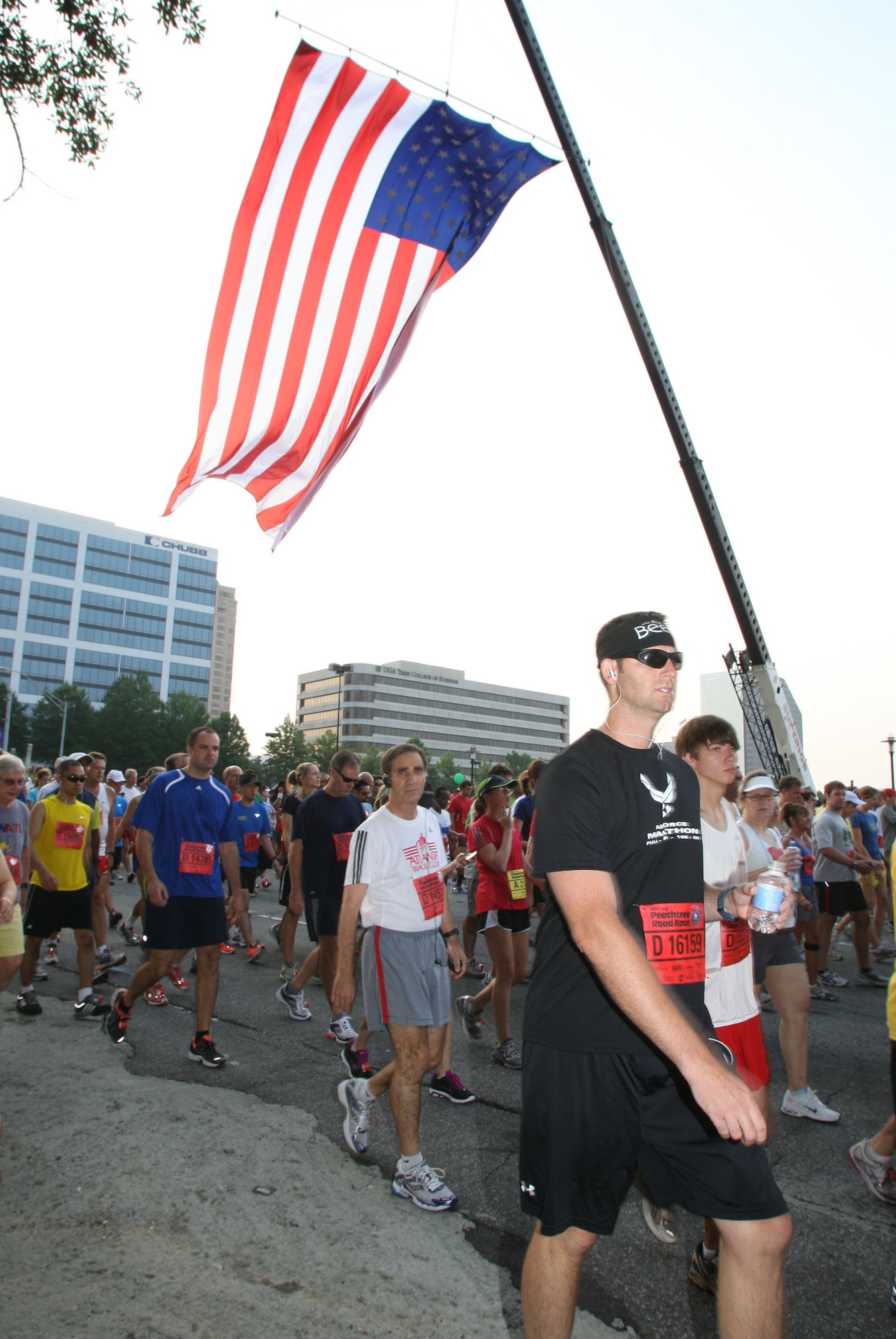 Senior Master Sgt. Scott E. Yoder, a loadmaster, assigned to the 700th Airlift Squadron, moves into position at the starting line during the Annual Peachtree 10k Road Race held in downtown Atlanta, Ga., July 4, 2011. (U.S. Air Force Photo/Don Peek)