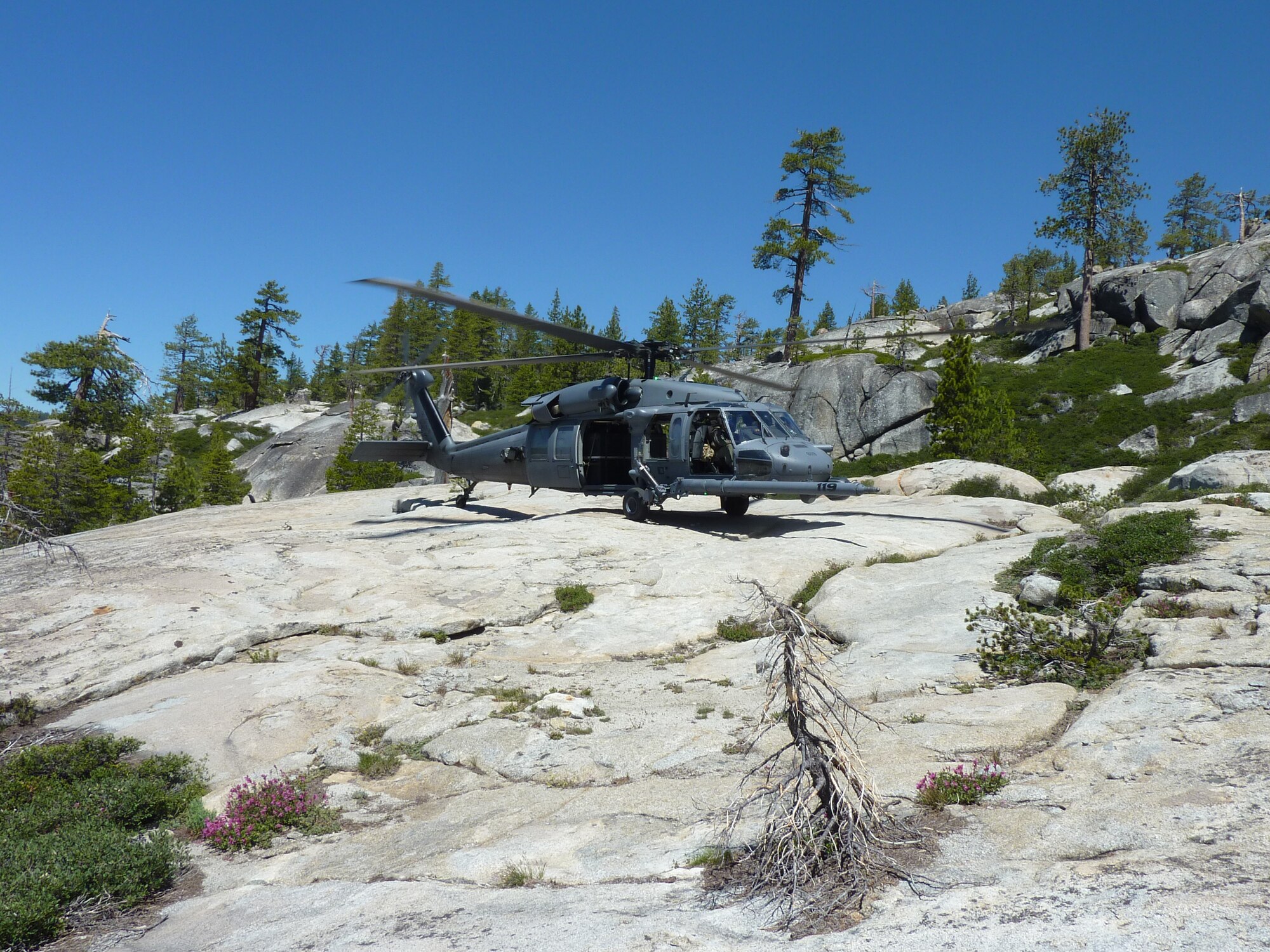 An HH-60G Pave Hawk helicopter from the 129th Rescue Wing lands in El Dorado National Forest, Calif. during a rescue mission on July 4, 2011.  An aircrew from 129th Rescue Wing rescued a lost hiker after she was missing in the forest for nearly 48 hours.  (California Air National Guard photo by Staff Sgt. Andrew Gibson)
