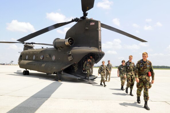 Civil Air Patrol members walk away from an Army Chinook helicopter. They were given a flight during the group's encampment at Robins. U. S. Air Force photo by Sue Sapp