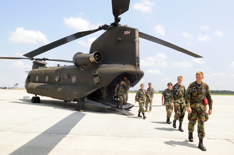 Civil Air Patrol members walk away from an Army Chinook helicopter. They were given a flight during the group's encampment at Robins. U. S. Air Force photo by Sue Sapp