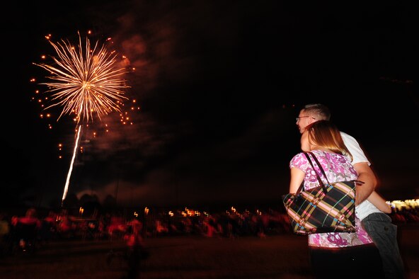 SEYMOUR JOHNSON AIR FORCE BASE, N.C. – Airman 1st Class Matt Carlson and his wife, Christina, watch the fireworks display while celebrating Independence Day here, June 30, 2011. Carlson, 4th Communications Squadron network operations administrator, hails from Buffalo, N.Y. (U.S. Air Force photo/Senior Airman Rae Perry/Released)