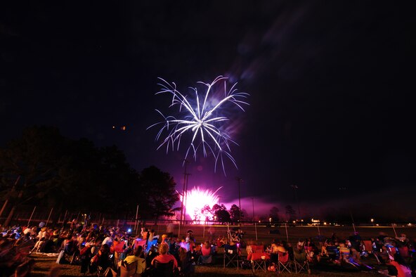 SEYMOUR JOHNSON AIR FORCE BASE, N.C. – Spectators are dazzled by fireworks during the Independence Day celebration here, June 30, 2011. An estimated 3,000 Airmen and family members attended the event.(U.S. Air Force photo/Senior Airman Rae Perry/Released)