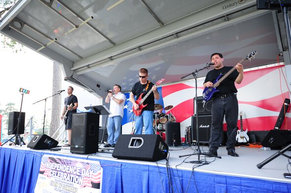 SEYMOUR JOHNSON AIR FORCE BASE, N.C. – The Chain of Command Band performs during the Independence Day celebration here, June 30, 2011. Members of the band include lead singer Peter Coffman, Brian Myers on lead guitar, Shane Washburn on second guitar, Vincent Ambrosio on bass and Russell Heinz on drums. All band members are from the 4th Fighter Wing. (U.S. Air Force photo/Senior Airman Rae Perry/Released)