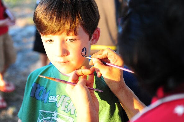 SEYMOUR JOHNSON AIR FORCE BASE, N.C. – Thomas Barker, 6, has his face painted with a patriotic theme during the Independence Day celebration here, June 30, 2011. Airmen and their families celebrated with several activities during the event including: a live band, kid’s zone, dunking booth and fireworks. Thomas’ father is Maj. Greg Barker, 916th Operations Support Squadron commander, who hails from Tampa, Fla. (U.S. Air Force photo/Senior Airman Rae Perry/Released)