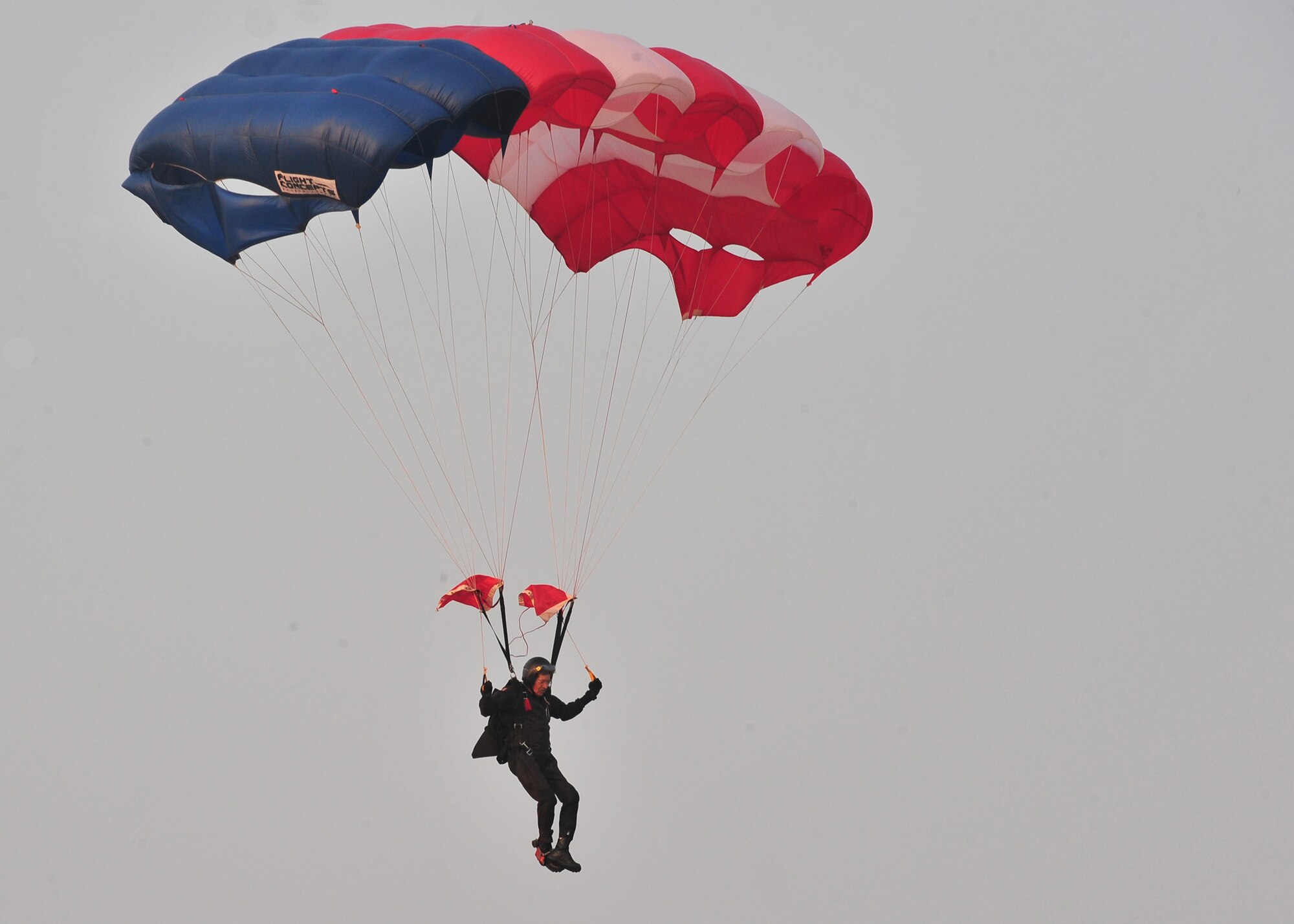 SHAW AIR FORCE BASE, S.C.-- Robert Scott, 20th Civil Engineering Squadron locksmith, parachutes down during the Jammin' July 4th celebration. The celebration allows the Sumter community and  Team Shaw to come together annually for food, fun and a fireworks show. Shaw helps sponsor the event every year to give back to the community for the support throughout the year. (U.S. Air Force photo by Airman 1st Class Ashley Gardner/ Released)