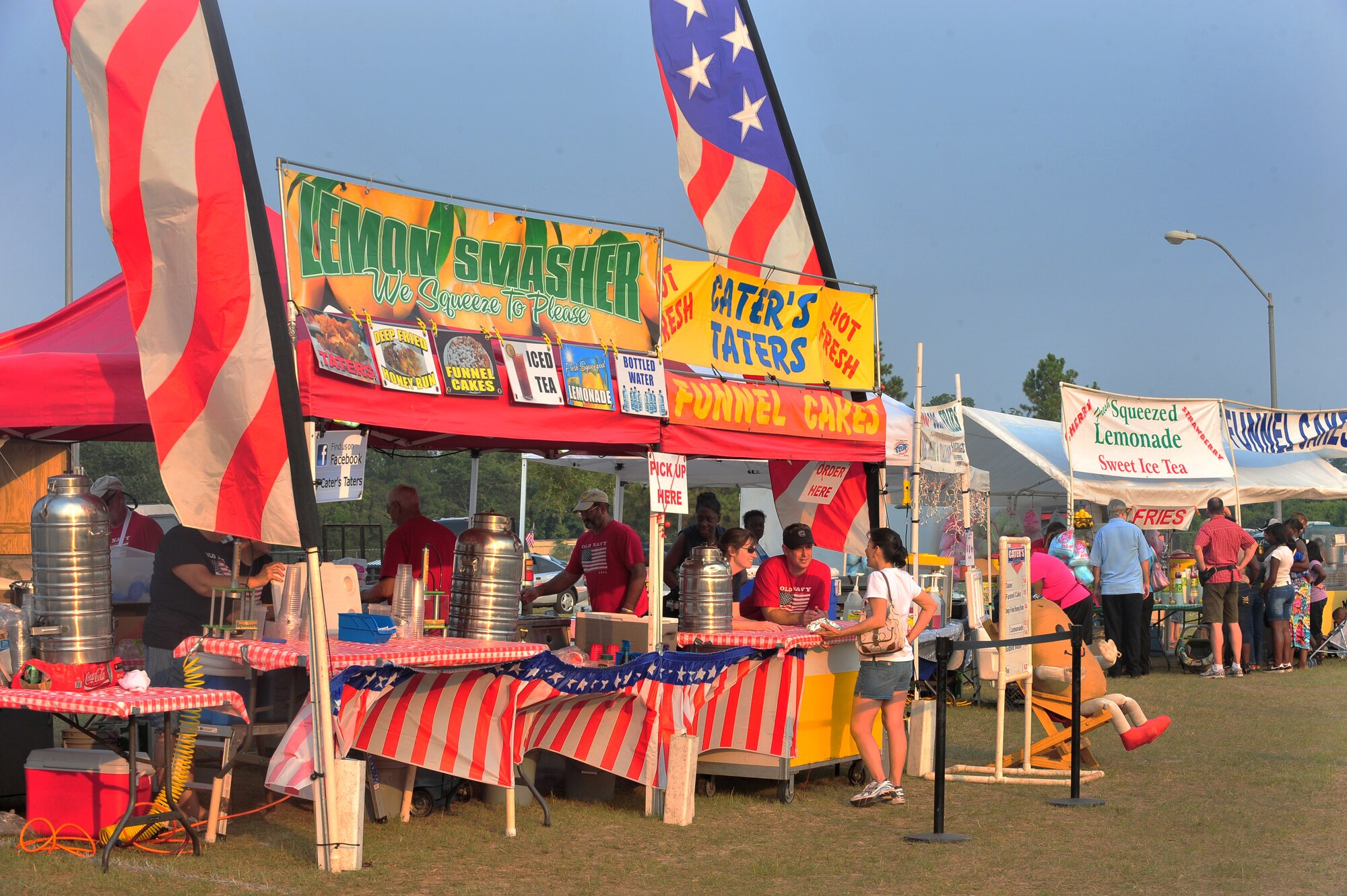 SHAW AIR FORCE BASE, S.C.-- Venders gather to sell everything from funnel cakes to Philly cheese steaks during the Jammin' July 4th celebration. The celebration allows the Sumter community and Team Shaw to come together annually for food, fun and a fireworks show. Shaw helps sponsor the event every year to give back to the community for the support throughout the year. (U.S. Air Force photo by Airman 1st Class Ashley Gardner/ Released)