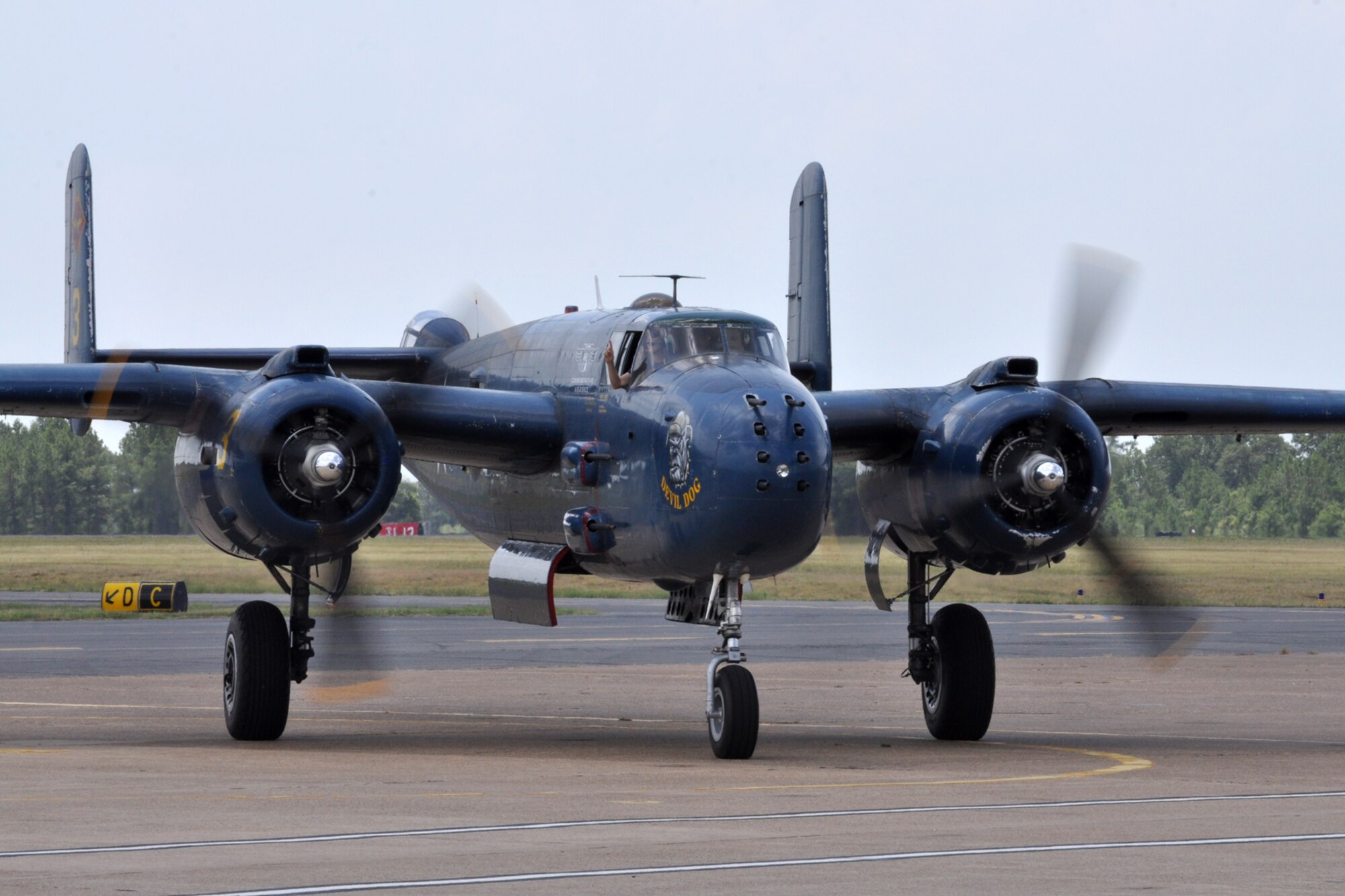 A B-25, piloted by Beth Jenkins, taxis in after performing at the “Wings Over Tyler Air Show” at the Tyler Pound Regional Airport in Tyler, Texas, June 3, 2011. Jenkins is the owner of a flight school in Georgetown, Texas, and the only female performer at the air show. She has more than 20,000 flying hours, 19,000 of those training pilots. At her side as co-pilot during the performance was Mark Frederick, who hails from Taylor, Texas. Jenkins plans to fly “Devil Dog,” the Marine version of the B-25 in more than 14 air shows this year. (U.S. Air Force photo/Tech. Sgt. Jeff Walston)