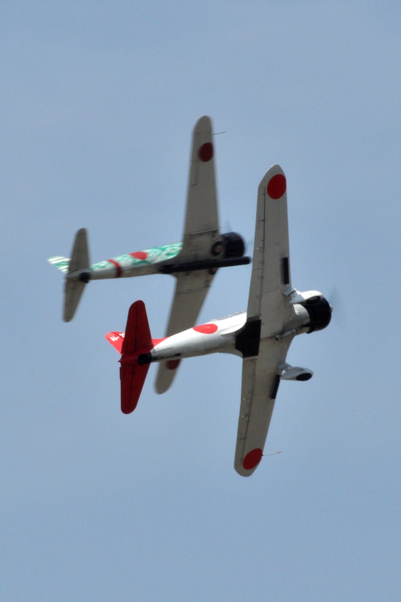 Two replica Japanese aircraft from the Commemorative Air Force’s “Tora! Tora! Tora!” performance, recreate the 1941 attack on Pearl Harbor during the “Wings Over Tyler Air Show” at Tyler Pounds Regional Airport, in Tyler, Texas, July 3, 2011. Designed as a living history lesson, “Tora! Tora! Tora!”  is intended as a memorial to all the soldiers on both sides who gave their lives for their countries. (U.S. Air Force photo/Tech. Sgt. Jeff Walston)