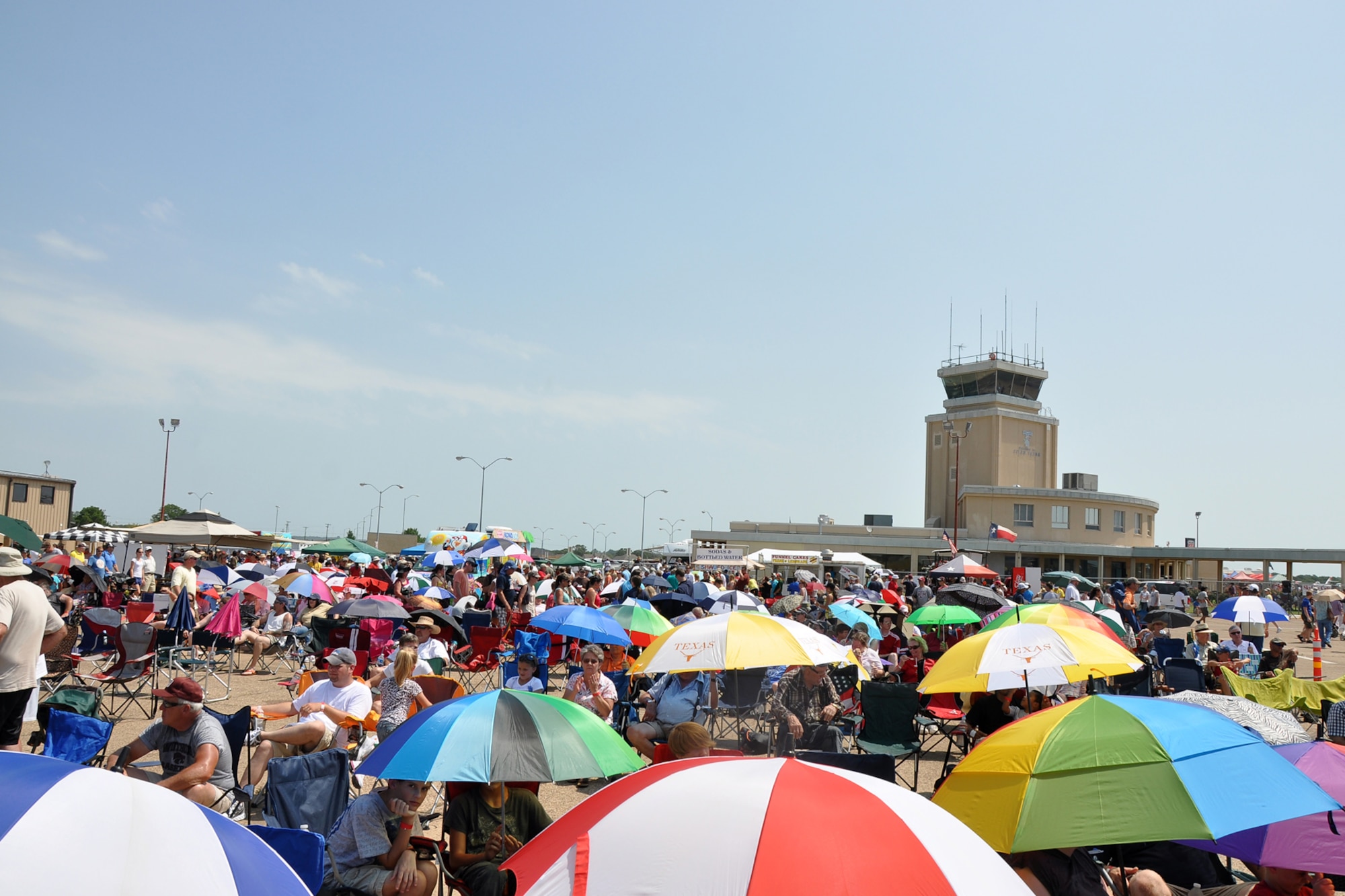 More than 20,000 spectators brave triple digit heat to watch the performers at the “Wings Over Tyler Air Show” at the Tyler Regional Airport in Tyler, Texas, July 3, 2011. Thousands of spectators crowded the airfield, toting lawn chairs, umbrellas and sun screen, determined to enjoy the show despite the triple-digit heat. (U.S. Air Force photo/Tech. Sgt. Jeff Walston)
