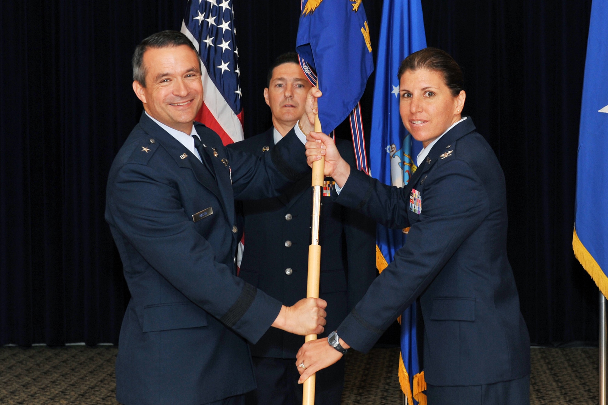 U.S. Air Force Brig. Gen. Donald Bacon, 55th Wing commander, passed the 55th Mission Support Group guidon to incoming commander U.S. Air Force Col. Andrea D. Tullos, during a change of command ceremony inside the Patriot Club on Offutt Air Force Base, Neb., July 6. 

U.S. Air Force Photo by Charles Haymond/Released