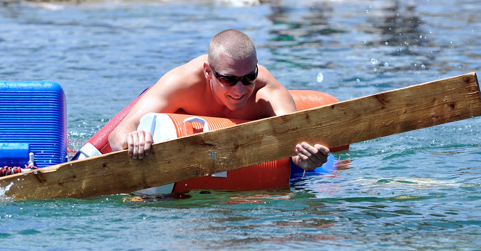 Alex Pressier attempts to steer C Flight's raft after it fell apart in the water June 25, 2011, during a Society of American Military Engineers camp at the Air Force Academy. (U.S. Air Force photo/Bill Evans)