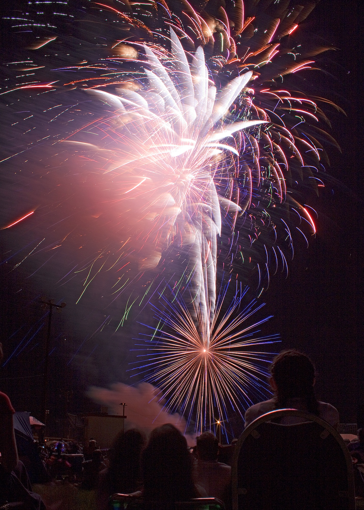 Hundreds of members of Team Edwards enjoy the fireworks display that culminated Summer Bash 2011 July 4. (Air Force photo by Jet Fabara)