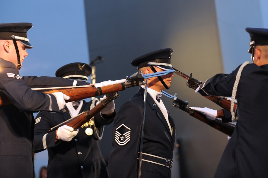 Master Sgt. Nathan Todd, U.S. Air Force Honor Guard Drill Team flight chief, stands motionless as the ceremonial guardsmen perform breath-taking maneuvers at Air Force Memorial in Arlington Va. July 4. The performance in honor of Independence Day was followed by the music provided by the U.S. Air Force Band. (U.S. Air Force photo by Staff Sgt. Christopher Ruano)