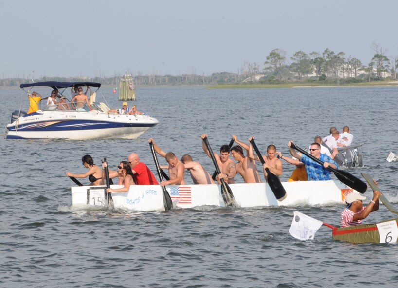The 1st Special Operations Equipment Maintenance Squadron’s “Prestige Abroad”  glides across the emerald waters during the 23rd Annual Cardboard Boat Regatta at the Marina at Hurlburt Field, Fla., July 1, 2011. The defending champion 1st SOEMS won 1st place in this year’s race. (Courtesy photo by Barbara Fuller/Released)
