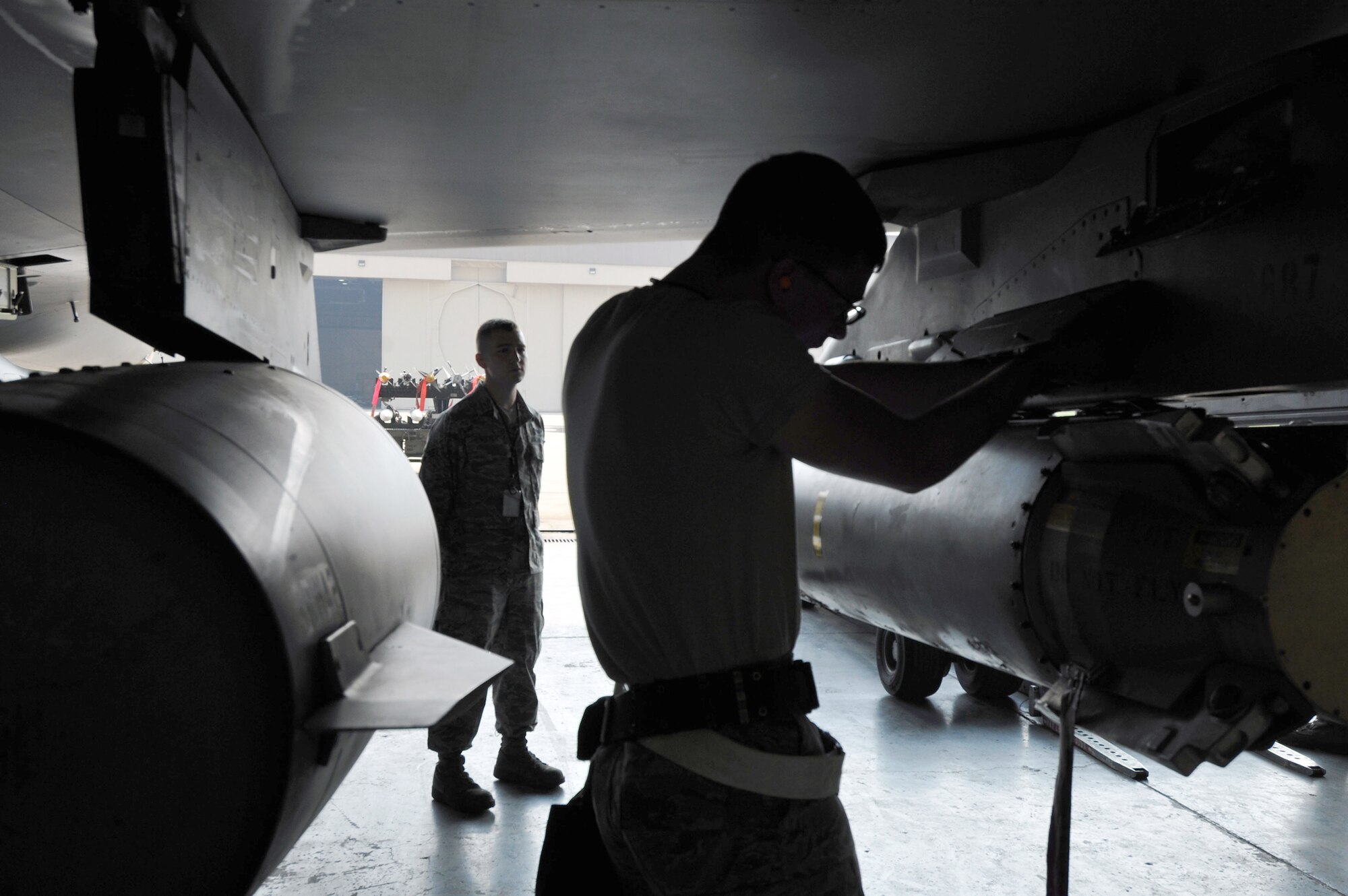 Members of a load crew participate in an evaluation June 28, 2011, at Kunsan Air Base, South Korea. (U.S. Air Force photo/Senior Airman Brittany Y. Bateman)